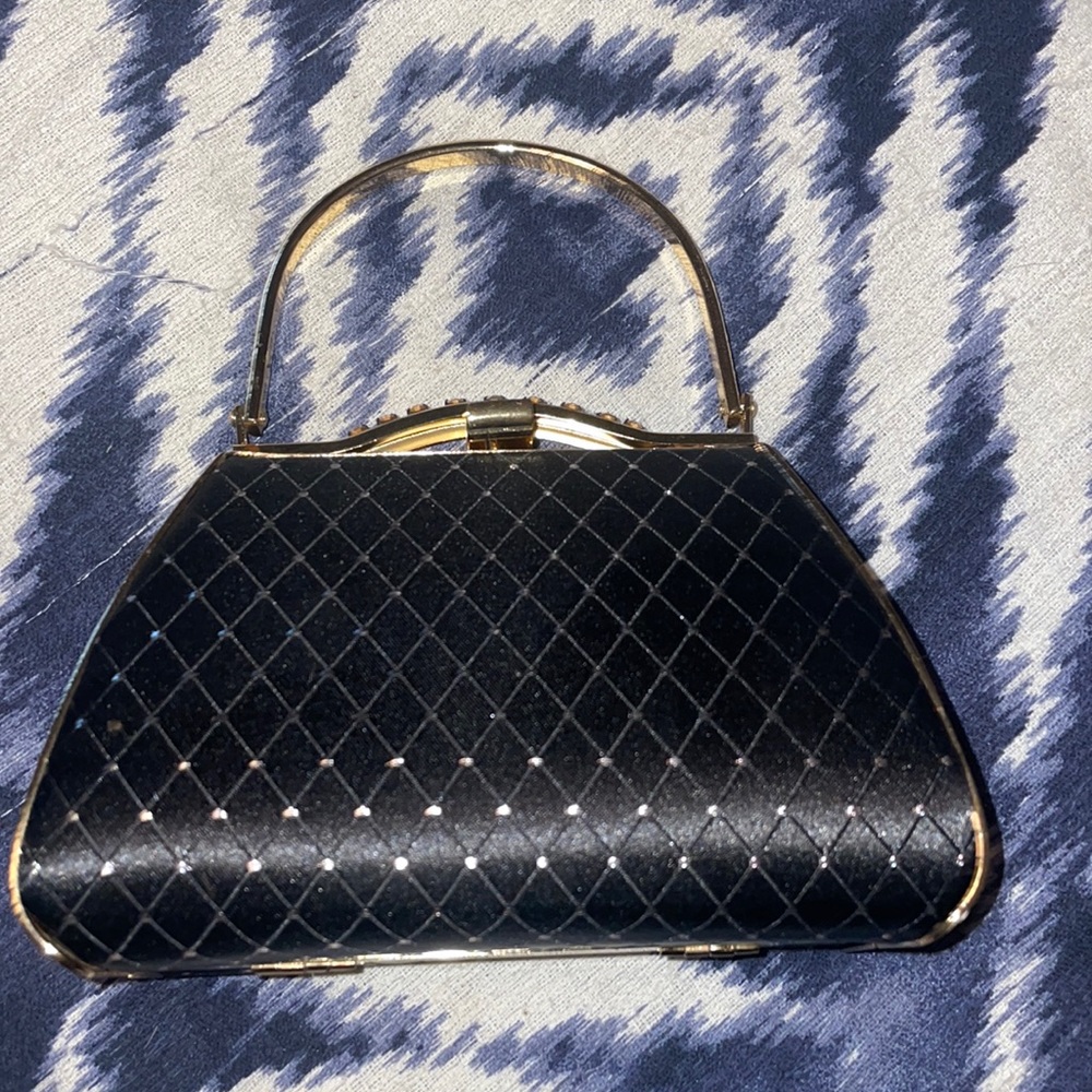vecelli Italian mini purse, black with gold outlining in perfect condition.